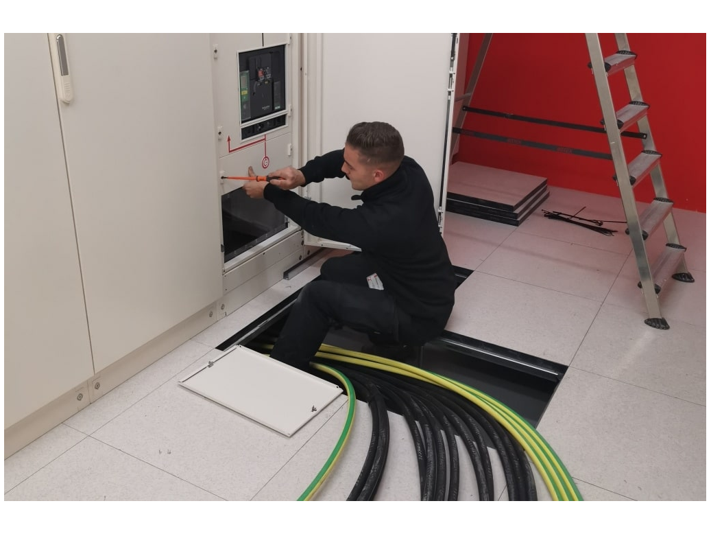 Technician working on floor infrastructure